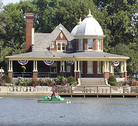 The Pavilion on the Lagoon with paddleboat floating past on the water