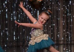 little girl dancing on stage